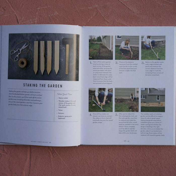 Gardening book: wooden stakes, twine, scissors, and a step-by-step guide for laying out and staking a raised garden bed.