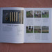 Gardening book: wooden stakes, twine, scissors, and a step-by-step guide for laying out and staking a raised garden bed.