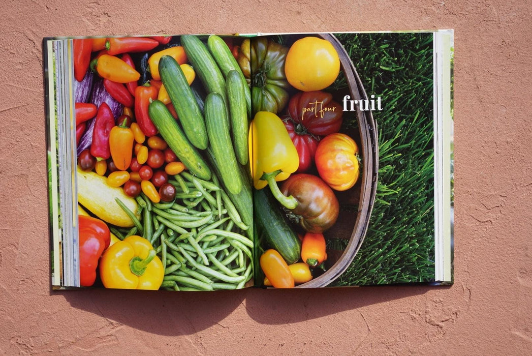 Vibrant cookbook spread: colorful fresh garden vegetables like tomatoes, peppers, cucumbers, green beans. "Fruit" section.