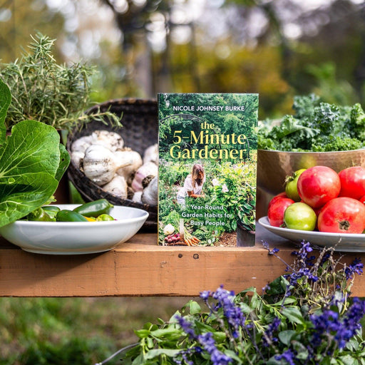 The 5-Minute Gardener book by Nicole Johnsey Burke, with fresh garden produce: kale, tomatoes, garlic, peppers, rosemary.