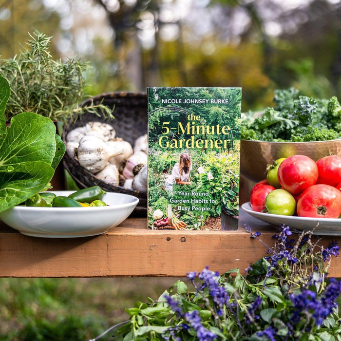 The 5-Minute Gardener book by Nicole Johnsey Burke, with fresh garden produce: kale, tomatoes, garlic, peppers, rosemary.
