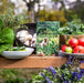 The 5-Minute Gardener book by Nicole Johnsey Burke, with fresh garden produce: kale, tomatoes, garlic, peppers, rosemary.