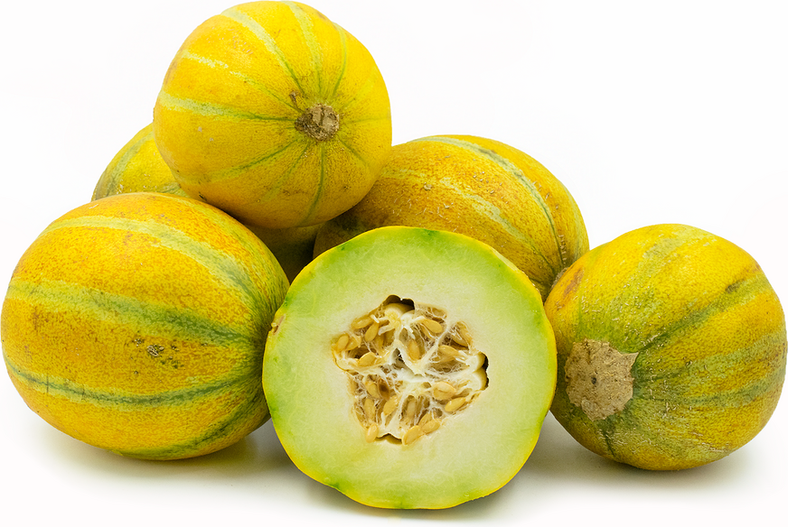 Yellow and green striped melons, one cut open revealing light green flesh and seeds. Fresh, sweet fruit produce.