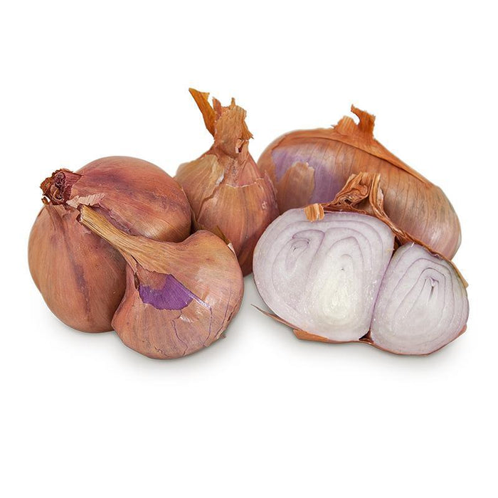 Fresh whole and cut shallots with reddish-brown skin and purple-white layered flesh.