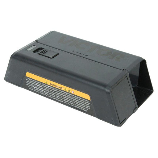 Black Victor electronic pest control trap with a top switch and yellow warning label.