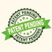 Green "PATENT PENDING" badge with ribbon and stars. Signifies intellectual property application status.
