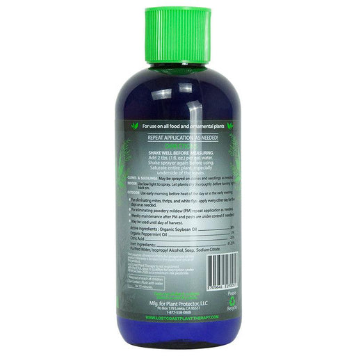 Lost Coast Plant Therapy organic pest & mildew control for food/ornamental plants. Blue bottle, green cap.