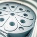 Gray plastic lab sample holder with multiple circular wells, possibly a centrifuge rotor or diagnostic tray.