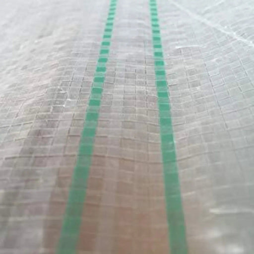 Translucent reinforced woven plastic tarp with green stripes. Durable protective sheeting for agriculture or construction.