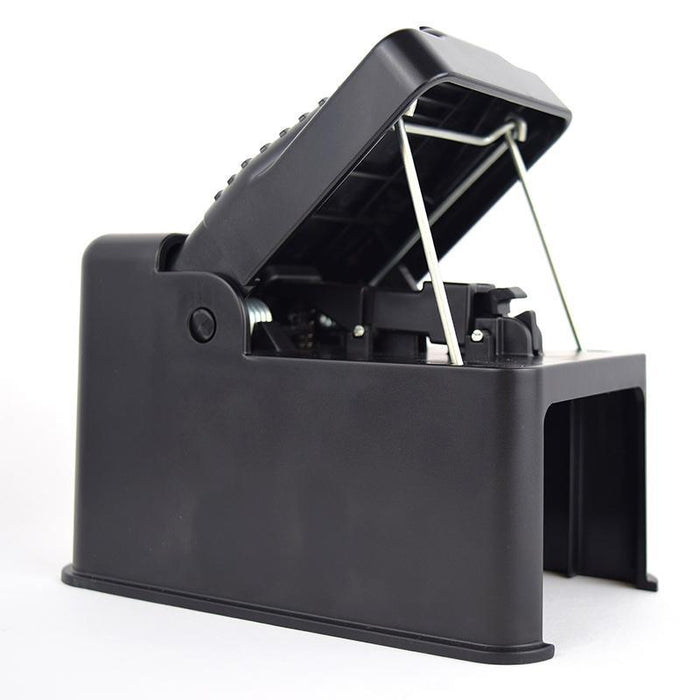 Reusable black plastic mouse trap, set open for effective rodent control.