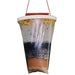Hanging clear fly trap with red top, filled with dead flies and attractant bait for outdoor pest control.
