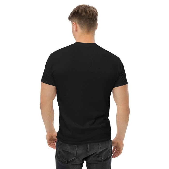 Man's back view in a black t-shirt and dark jeans. Blank tee mockup, men's casual fashion.