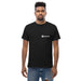 Man wearing black Seedtime t-shirt, casual streetwear, ripped denim jeans. Men's apparel.