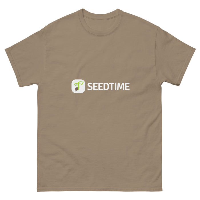 Tan t-shirt featuring the Seedtime logo with a green sprout icon and white "SEEDTIME" text. Casual gardening apparel.