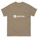 Tan t-shirt featuring the Seedtime logo with a green sprout icon and white "SEEDTIME" text. Casual gardening apparel.