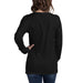 Woman's back in black long-sleeve t-shirt and blue jeans. Blank long sleeve tee mockup for women.