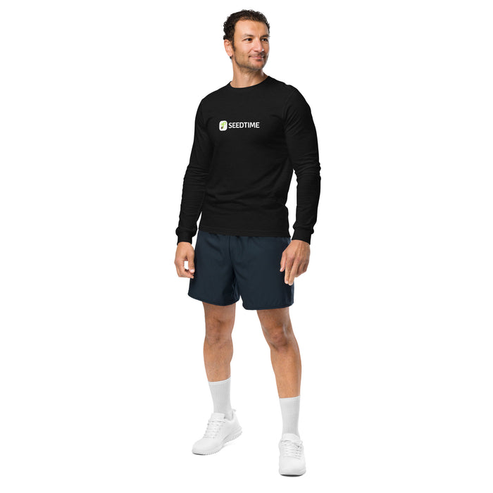 Man modeling a black Seedtime long-sleeve shirt, navy shorts, white socks, and white sneakers.