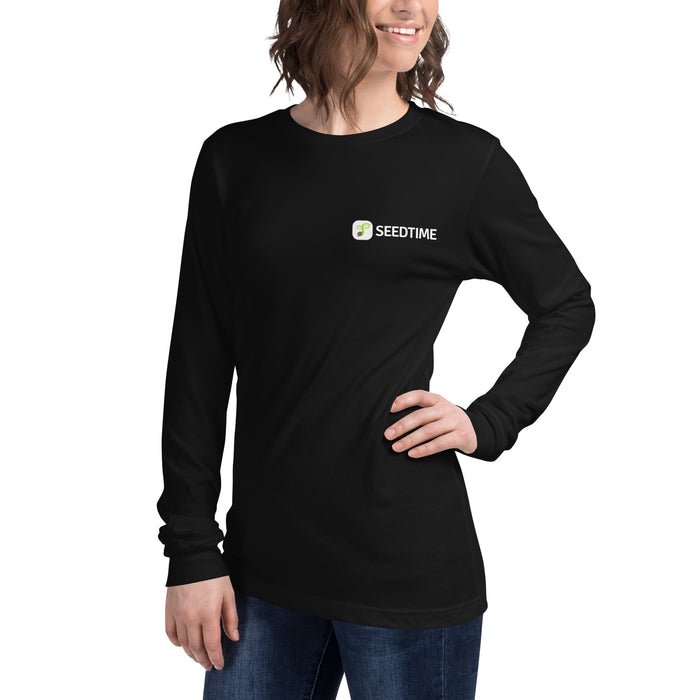 Black long-sleeve t-shirt with Seedtime logo worn by a smiling woman. Casual women's gardening apparel.
