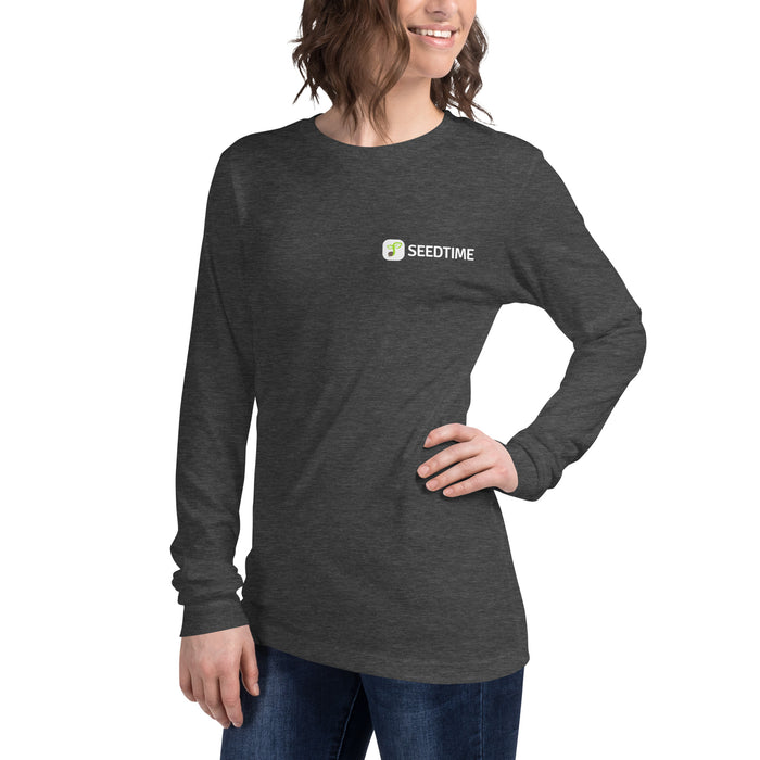 Woman wearing a charcoal long-sleeve t-shirt with the Seedtime plant logo. Comfortable, stylish women's apparel.