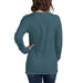 Woman wearing heather teal long sleeve t-shirt, back view. Blank casual women's apparel mockup.