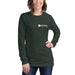 Smiling woman wearing a heather forest Seedtime long-sleeve t-shirt and blue jeans.