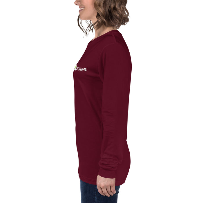 Smiling woman in maroon long-sleeve t-shirt with SEEDTIME logo. Burgundy casual women's top.