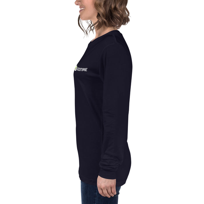 Smiling woman in navy blue long-sleeve Seedtime logo shirt. Women's casual apparel.