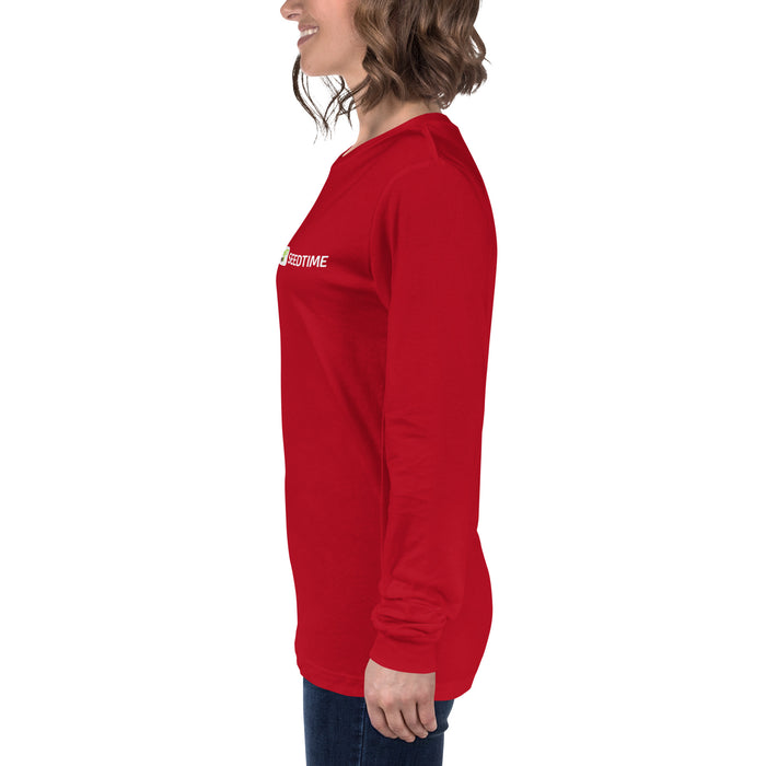 Smiling woman in red long-sleeve t-shirt with Seedtime plant logo. Casual women's apparel.