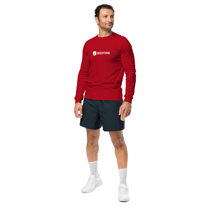Man in red Seedtime long-sleeve shirt, dark shorts, white sneakers. Gardening clothing, men's apparel.