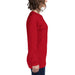 Woman wearing a solid red long sleeve t-shirt, side view. Comfortable women's casual top, versatile apparel.
