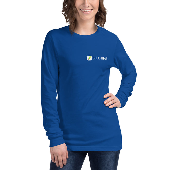 Royal blue Seedtime long-sleeve t-shirt for women. Smiling model wears comfortable apparel with Seedtime logo.