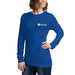 Smiling woman in royal blue long-sleeve t-shirt with Seedtime logo. Comfortable women's apparel.