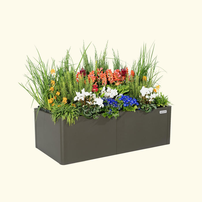 Rectangular anthracite Vego Garden planter box with vibrant orange, white, blue flowers, and lush green plants.