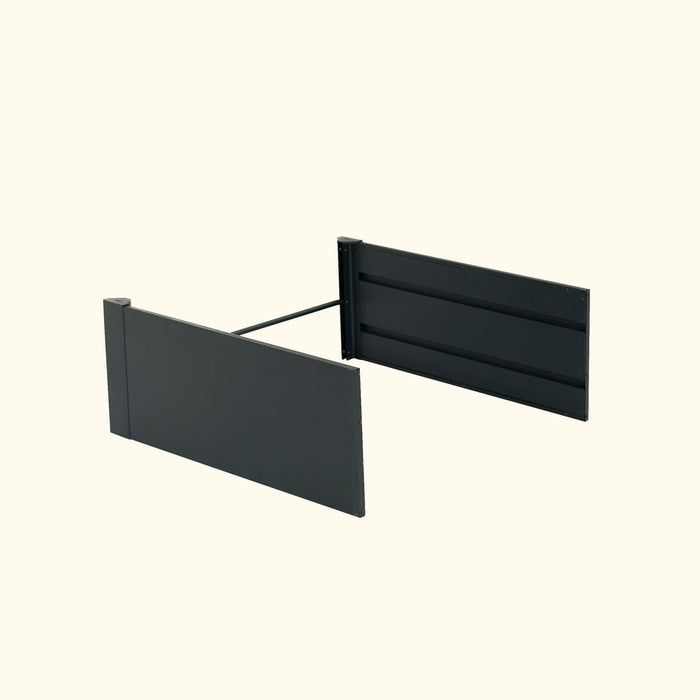 Modular dark grey metal raised garden bed panels with connecting bar. Modern outdoor planter kit.