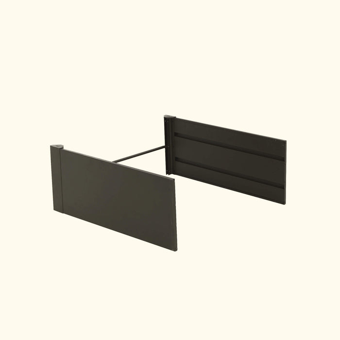 Dark grey modular panels connected by a rod. Modern outdoor fence, privacy screen, or raised garden bed components.