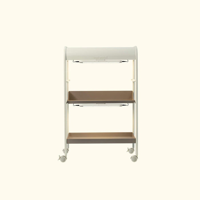Modern white Vego Garden indoor plant stand with two brown shelves, integrated LED grow lights, and casters.