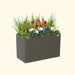 Vego Garden modern charcoal raised garden bed with vibrant mixed flowers: orange, red, white, and blue blooms.