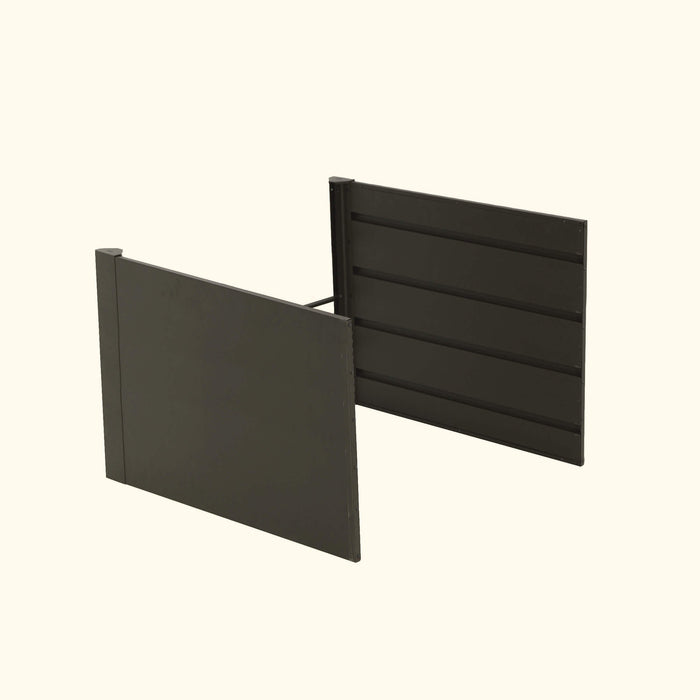 Dark gray modular fence panels for modern garden privacy screen or outdoor partition.