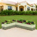 L-shaped sage green self-watering raised garden bed filled with herbs, flowers, and leafy greens on a patio.