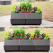 Vego Garden two-tone gray planter box with ribbed design, filled with colorful flowers and diverse green plants.