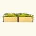 Modern wooden raised garden bed planter with black trim, bursting with colorful yellow, orange, and purple flowers.