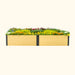Rectangular light wood raised garden bed with black accents, overflowing with vibrant yellow, orange, and purple flowers.