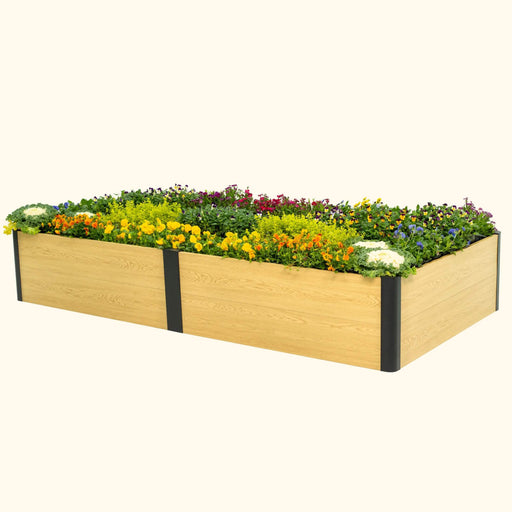 Rectangular wood-look raised garden bed with black metal frame, overflowing with colorful flowers & green plants.