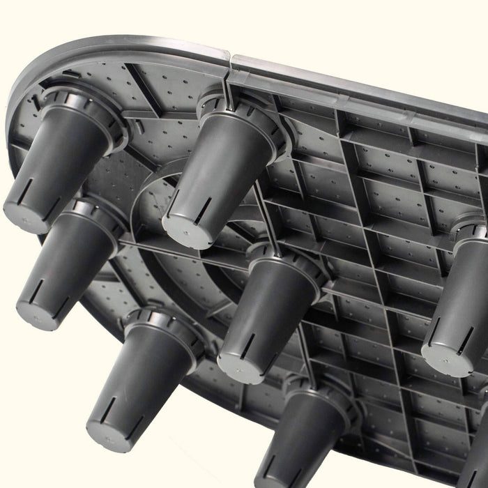 Modular dark grey plastic planter base with aeration cups and drainage grid for raised garden beds.