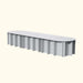 Modern oval grey garden bench with corrugated base. Sleek outdoor seating, minimalist design.