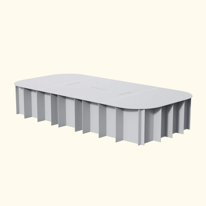 Modern gray rectangular raised garden bed with fluted side panels and rounded corners. Features 'veggie garden' text on top.