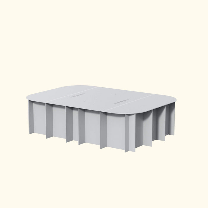 Light gray rectangular raised garden bed with rounded top and vertical panel sides. Features "veggie garden" text.