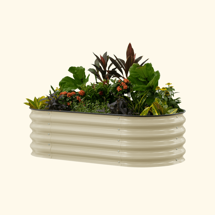 Cream corrugated metal raised garden bed with vibrant plants, herbs, and colorful flowers.