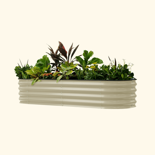 Neutral beige corrugated steel raised garden bed with diverse green plants and colorful flowers.