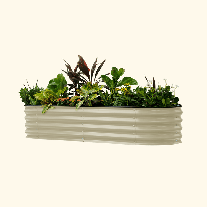 Neutral beige corrugated steel raised garden bed with diverse green plants and colorful flowers.